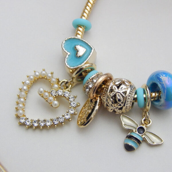 Blue Heart & Bee Charm Bracelet with enamel heart, bee pendant and aqua bead charms on adjustable gold snake chain