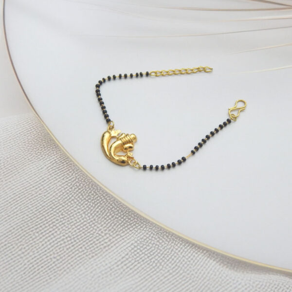 Gold Ganesha charm bracelet with black beads