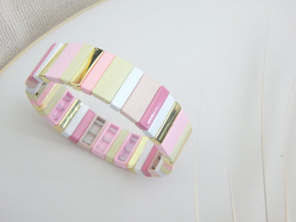Square tile stretch bracelet in pastel shades (pink/cream/yellow) with gold‑trim