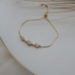 Gold-toned bracelet with marquise-cut crystal stones and wrap design