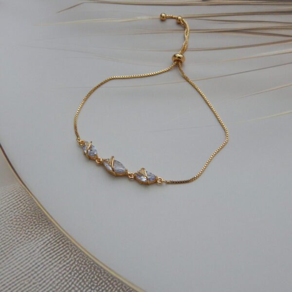 Gold-toned bracelet with marquise-cut crystal stones and wrap design