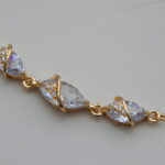 Gold-toned bracelet with marquise-cut crystal stones and wrap design
