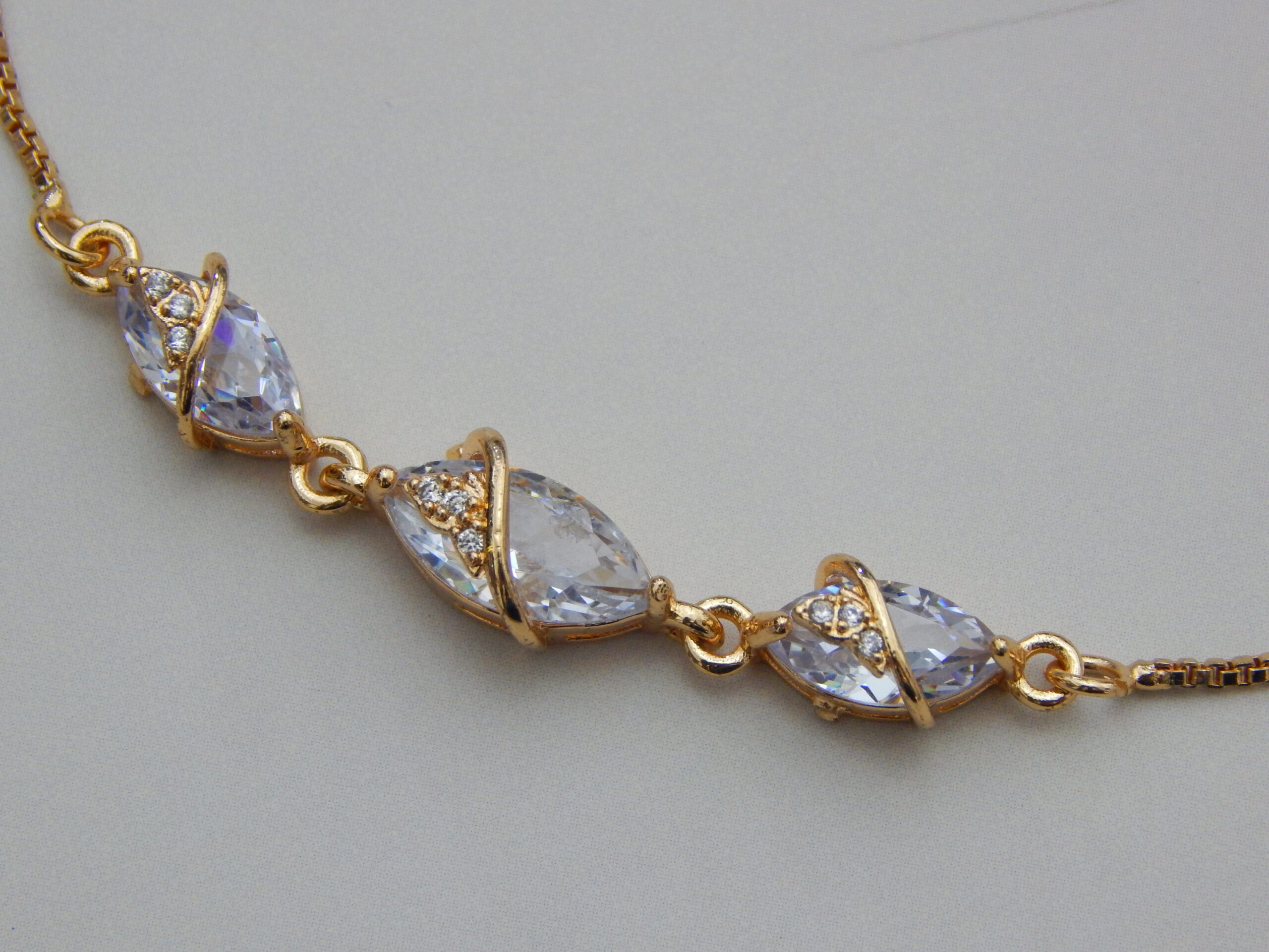 Gold-toned bracelet with marquise-cut crystal stones and wrap design