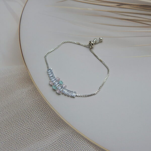 Rose gold bracelet with mint green center flower and baguette stones