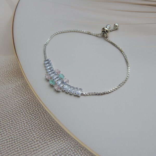 Rose gold bracelet with mint green center flower and baguette stones