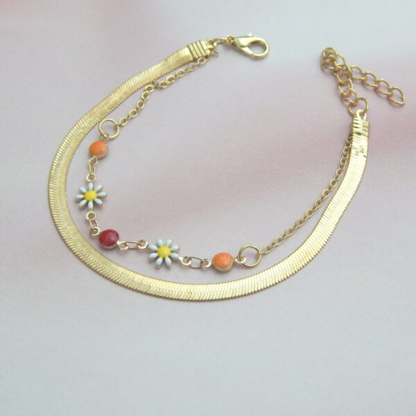 Gold chain bracelet with multicolor beads and floral charms