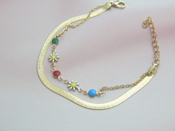 Gold chain bracelet with multicolor beads and floral charms