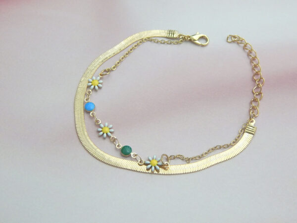 Gold chain bracelet with multicolor beads and floral charms