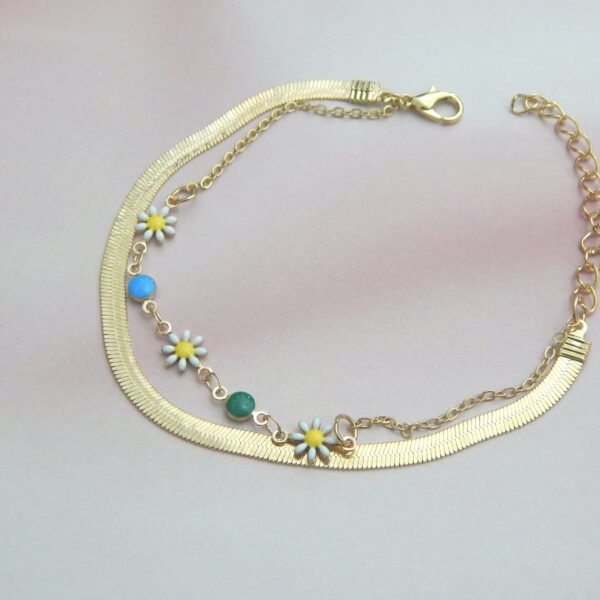 Gold chain bracelet with multicolor beads and floral charms