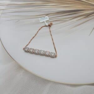 Rectangular halo bracelet in rose gold finish — six large faceted stones in bold rectangular halos on box chain