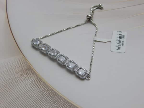 Rectangular halo bracelet in silver finish — six large faceted stones in bold rectangular halos on box chain