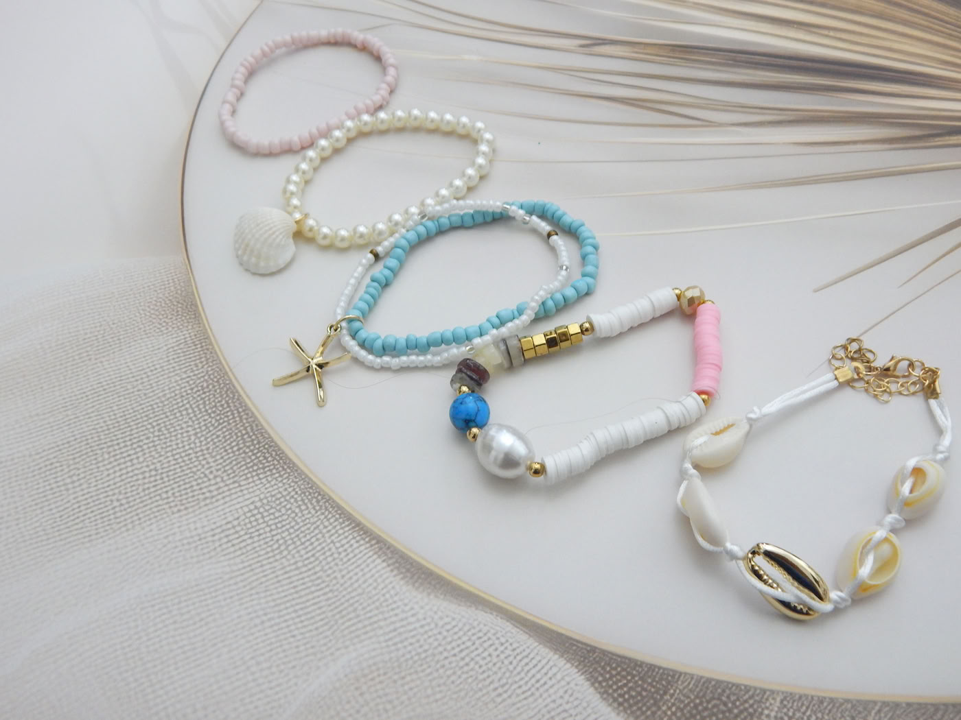 Set of 5 pastel and white beach-inspired bracelets with shell, pearl, starfish, and cowrie charms – Royal Reflection