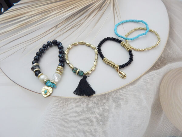 Set of 5 black, turquoise, and gold beaded charm bracelets with heart, shell, and tassel accents – Royal Reflection DS