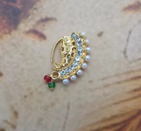 Gold-toned curved Nath with white crystals, pearl fringe, and colorful bead drops under ₹70