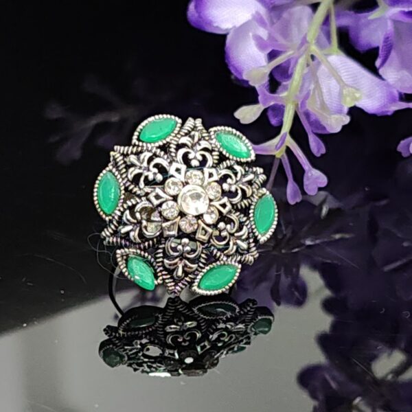 Emerald Crest Oxidised Floral Ring with Green Stone Accents and Crystal Center – Royal Reflection DS