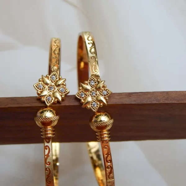 Gold-plated floral etch kada with diamond-like flower motif and engraved band