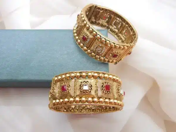 Antique gold beaded kada set with double bead border and ruby Kundan style stones — pair view
