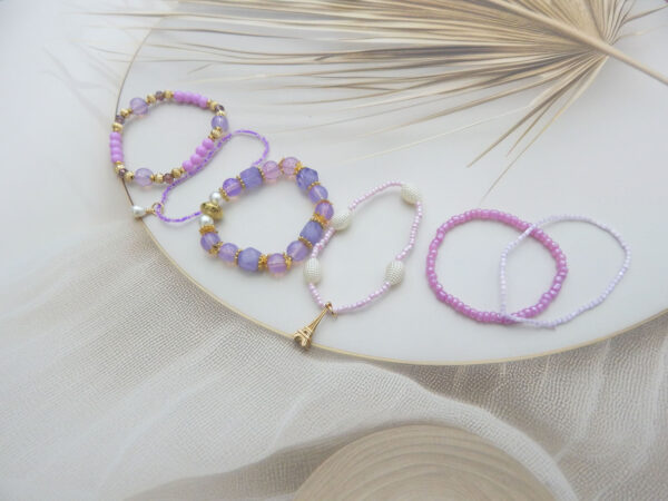 Lavender and pink bracelet set with Eiffel Tower and pearl charms – set of 5 stylish beaded bracelets under ₹299