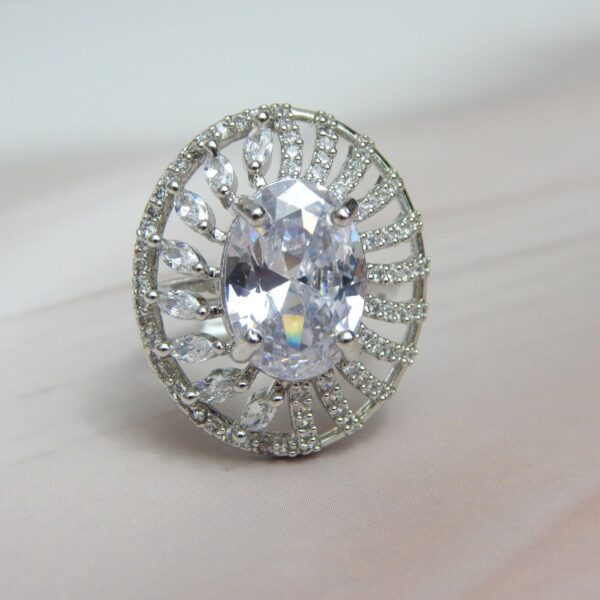 Silver-Toned Oval Statement Ring with Central Solitaire and Petal Halo – Royal Reflection DS