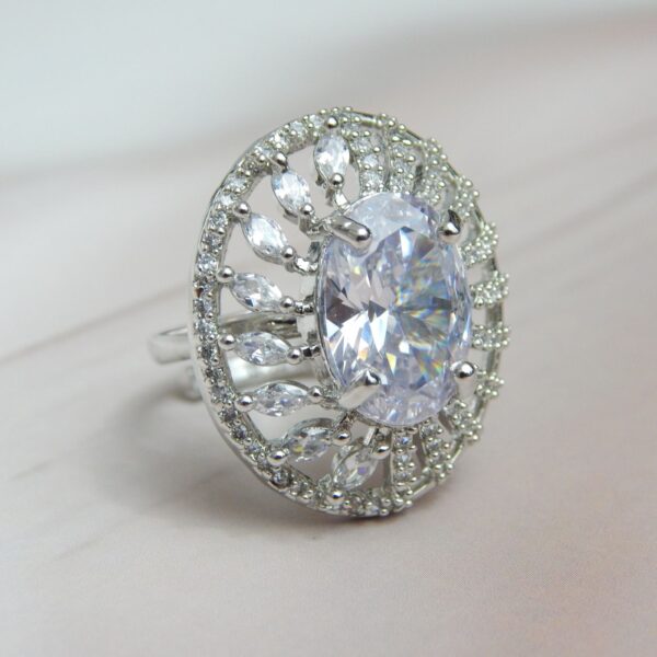 Silver-Toned Oval Statement Ring with Central Solitaire and Petal Halo – Royal Reflection DS