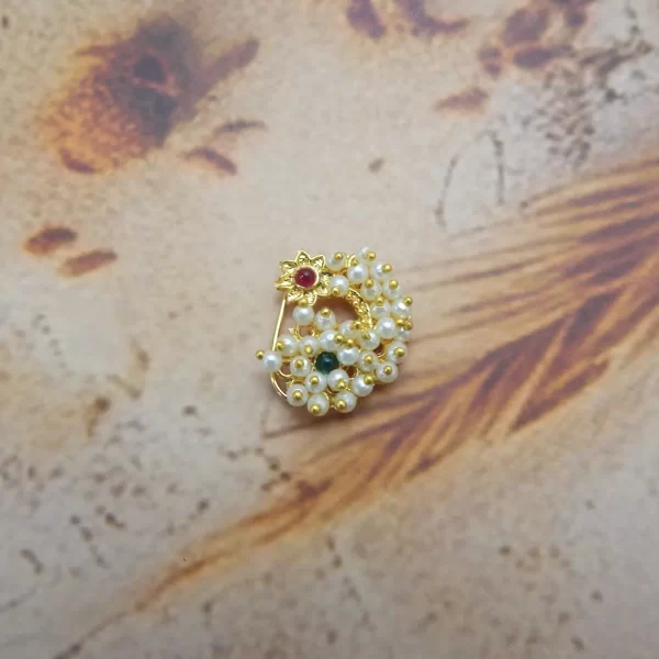 Gold-toned imitation nath with red floral star top and pearl beaded halo under ₹70
