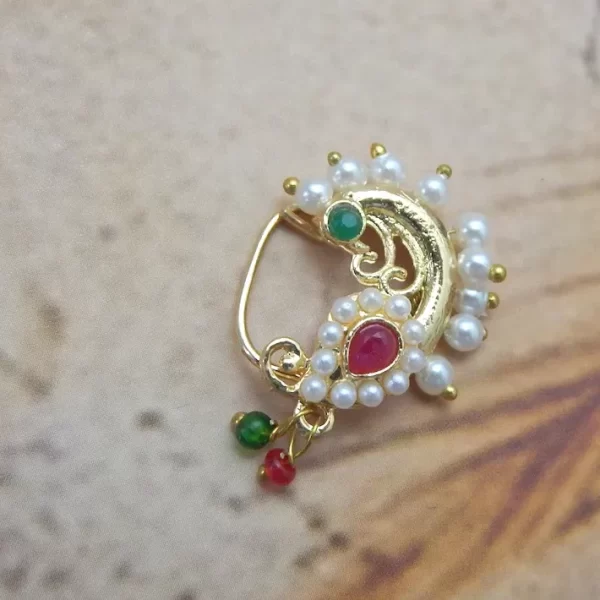 Golden swirl Nath with red centerpiece, pearl outline, and green-red beads under ₹70