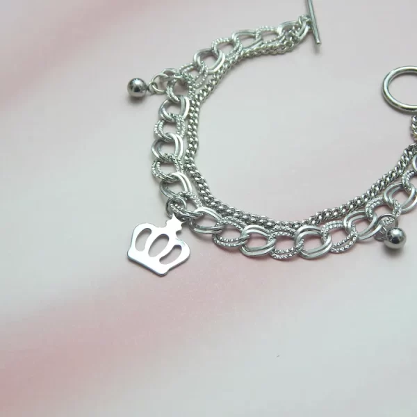 Silver chain bracelet with crown-shaped charm for everyday wear