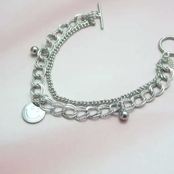Silver chain bracelet with smiley face charm in lightweight finish