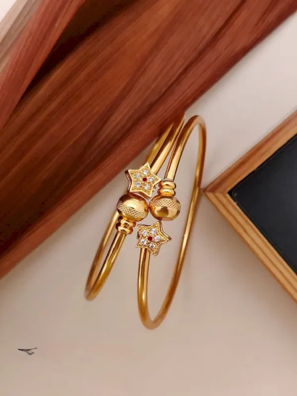 Starburst gold kada with twin star crystal charms and textured ball caps – affordable festive jewellery at ₹160