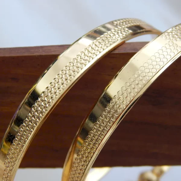 Symphonic gold kada with glossy finish and twin ball detailing – imitation jewellery for ₹220