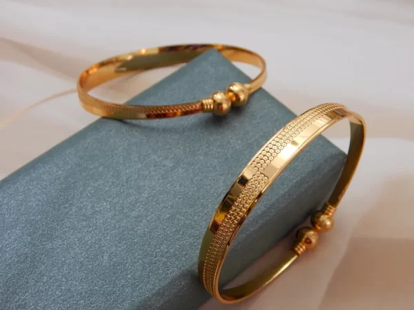 Symphonic gold kada with glossy finish and twin ball detailing – imitation jewellery for ₹220