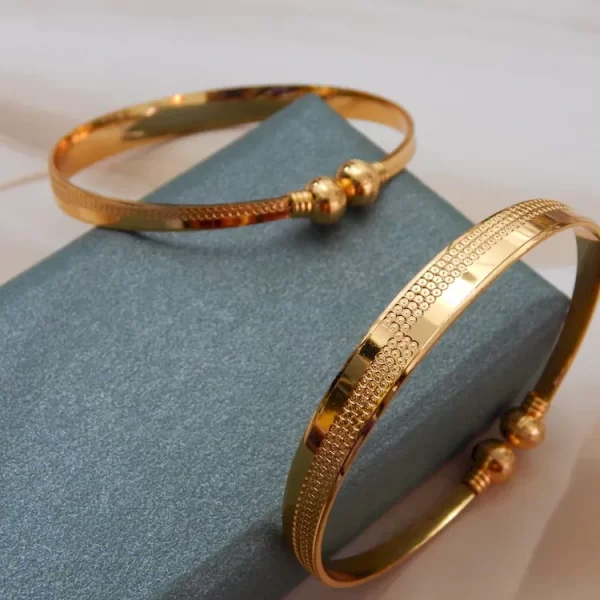 Symphonic gold kada with glossy finish and twin ball detailing – imitation jewellery for ₹220