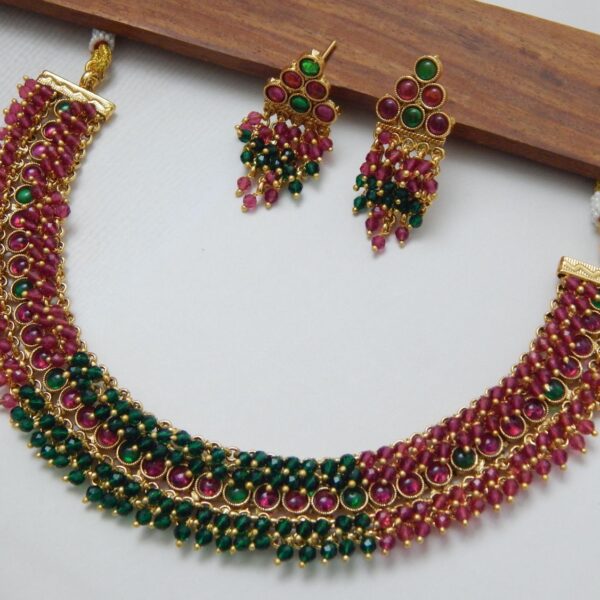 Beaded Kundan Necklace Set with Ruby-Green Layered Drops and Matching Earrings – Royal Reflection DS