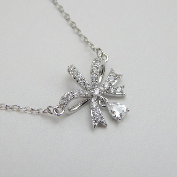 Bow Indulgence Pendant Set – Silver Finish with Matching Earrings – Royal Reflection DS