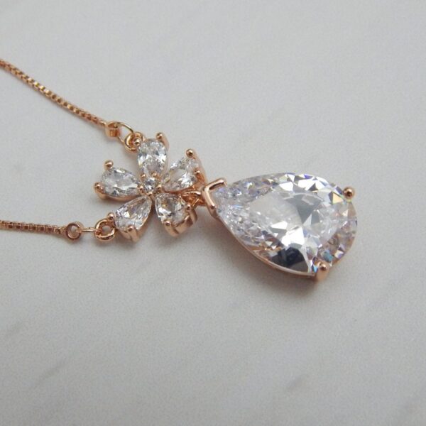 Crystal Blossom Drop Pendant Set with Teardrop Stone and Floral Accents – Royal Reflection DS