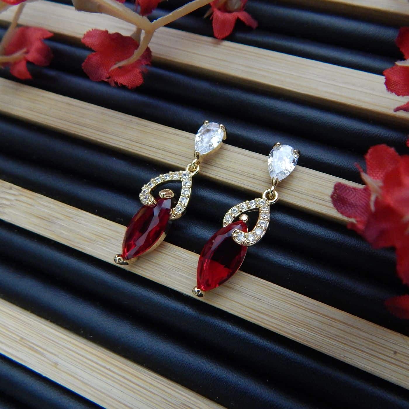 Home - Royal Reflection Red stone dangler earrings with American diamond accents in gold-toned setting