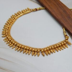 Full View of Gold Beaded Necklace Set on Display Stand – Royal Reflection DS