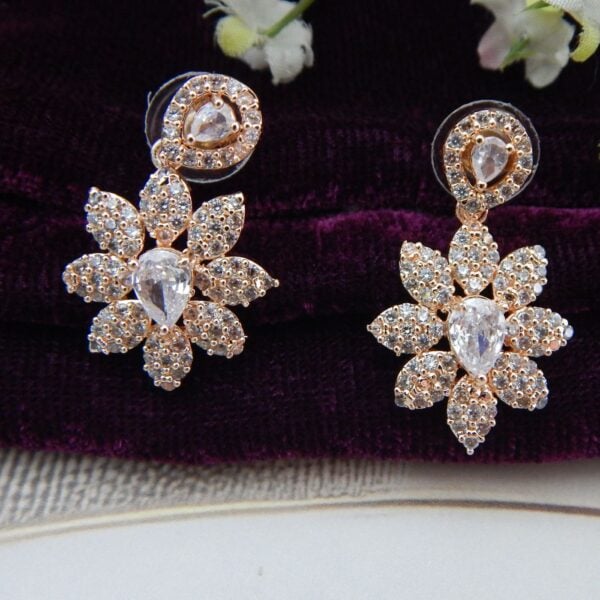 Navratri Yellow Jewellery - Royal Reflection DS Close-up of Gul Bahar designer floral necklace and earring set in a rose gold finish with an intricate floral design