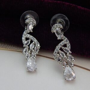 A graceful Y-shaped designer necklace with a teardrop pendant and matching drop earrings in a silver tone.