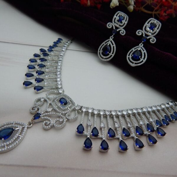 Navratri Royal Blue Jewellery - Royal Reflection DS Navy blue american diamond fringe necklace with cascading teardrop drops and scrollwork centre
