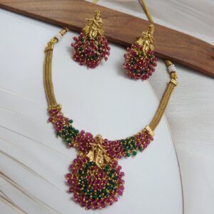 Krishna Motif Necklace Set with Ruby-Green Pearl Drops and Gold Polish – Royal Reflection DS