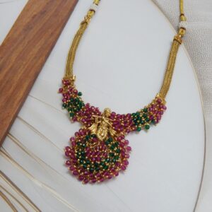 Krishna Motif Necklace Set with Ruby-Green Pearl Drops and Gold Polish – Royal Reflection DS