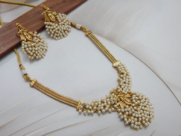 Radha-Krishna Necklace Set with White Pearl Clusters and Gold Finish – Royal Reflection DS