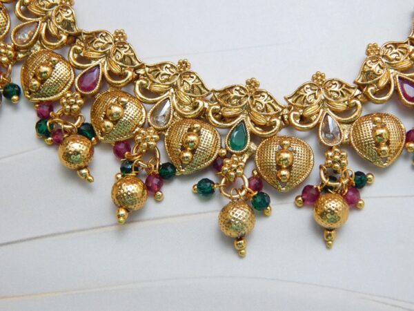 Lakshmi Temple Gold Necklace Set with Antique Finish and Kemp Stone Detailing – Royal Reflection DS