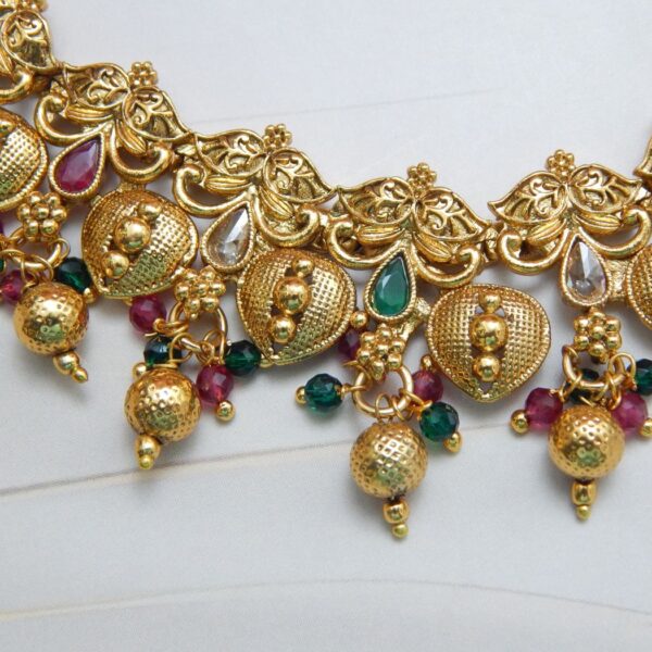 Lakshmi Temple Gold Necklace Set with Antique Finish and Kemp Stone Detailing – Royal Reflection DS