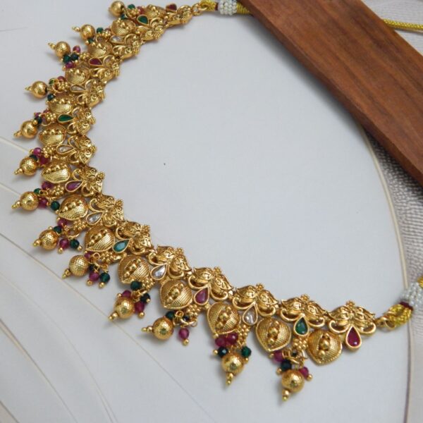 Lakshmi Temple Gold Necklace Set with Antique Finish and Kemp Stone Detailing – Royal Reflection DS