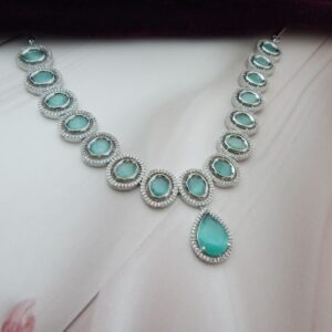 A designer choker necklace and earring set featuring a floral cluster design and a silver finish.