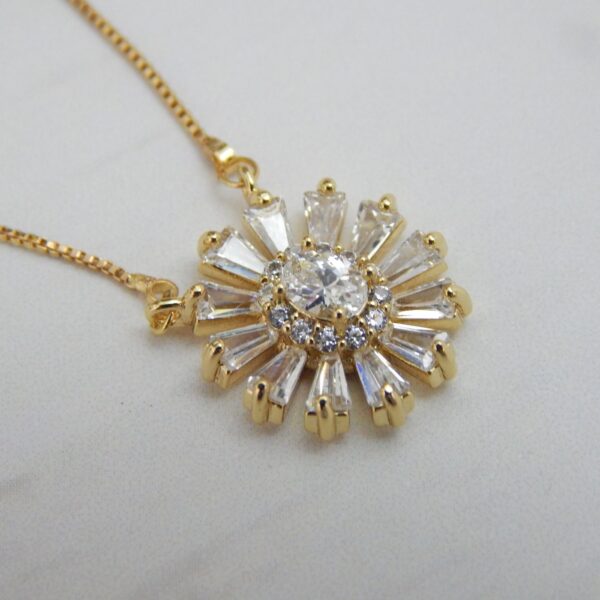 Radiant Bloom Pendant Set in Gold Finish with Sunburst Crystal Design – Royal Reflection DS