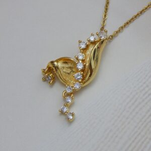 Radiant Leaf Curve Gold Necklace with Sparkling CZ Accents – Royal Reflection DS