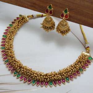 Guttapusalu necklace set with jhumka earrings in Multi — ruby red and green teardrop stones on gold bead base